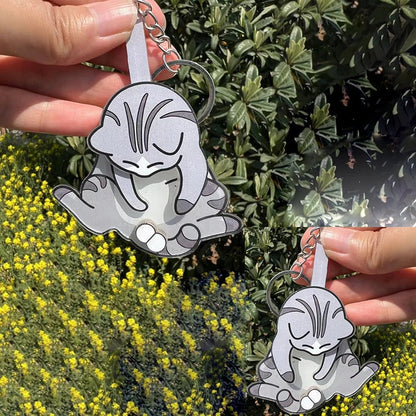 Playing with eggs and kitten keychain