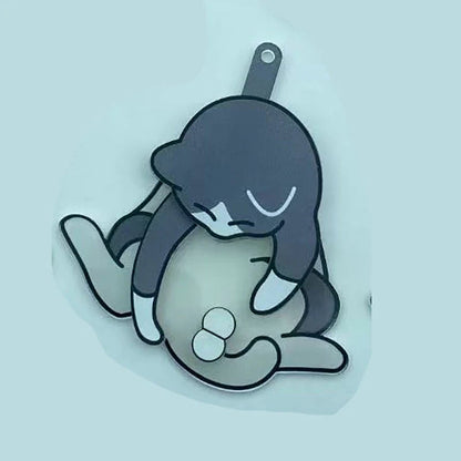 Playing with eggs and kitten keychain