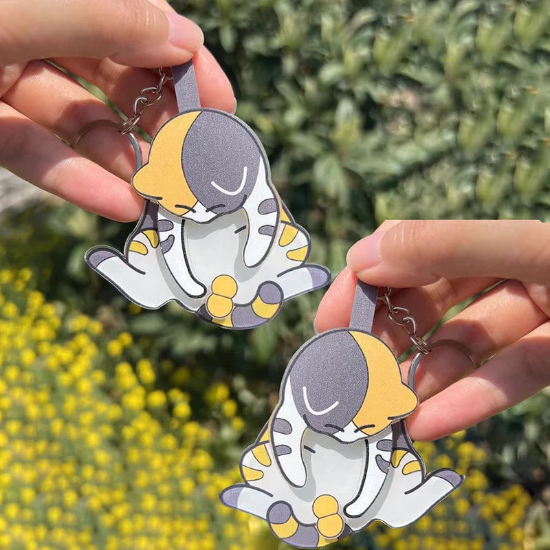 Playing with eggs and kitten keychain