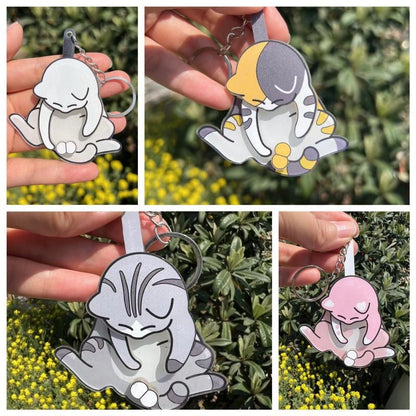 Playing with eggs and kitten keychain